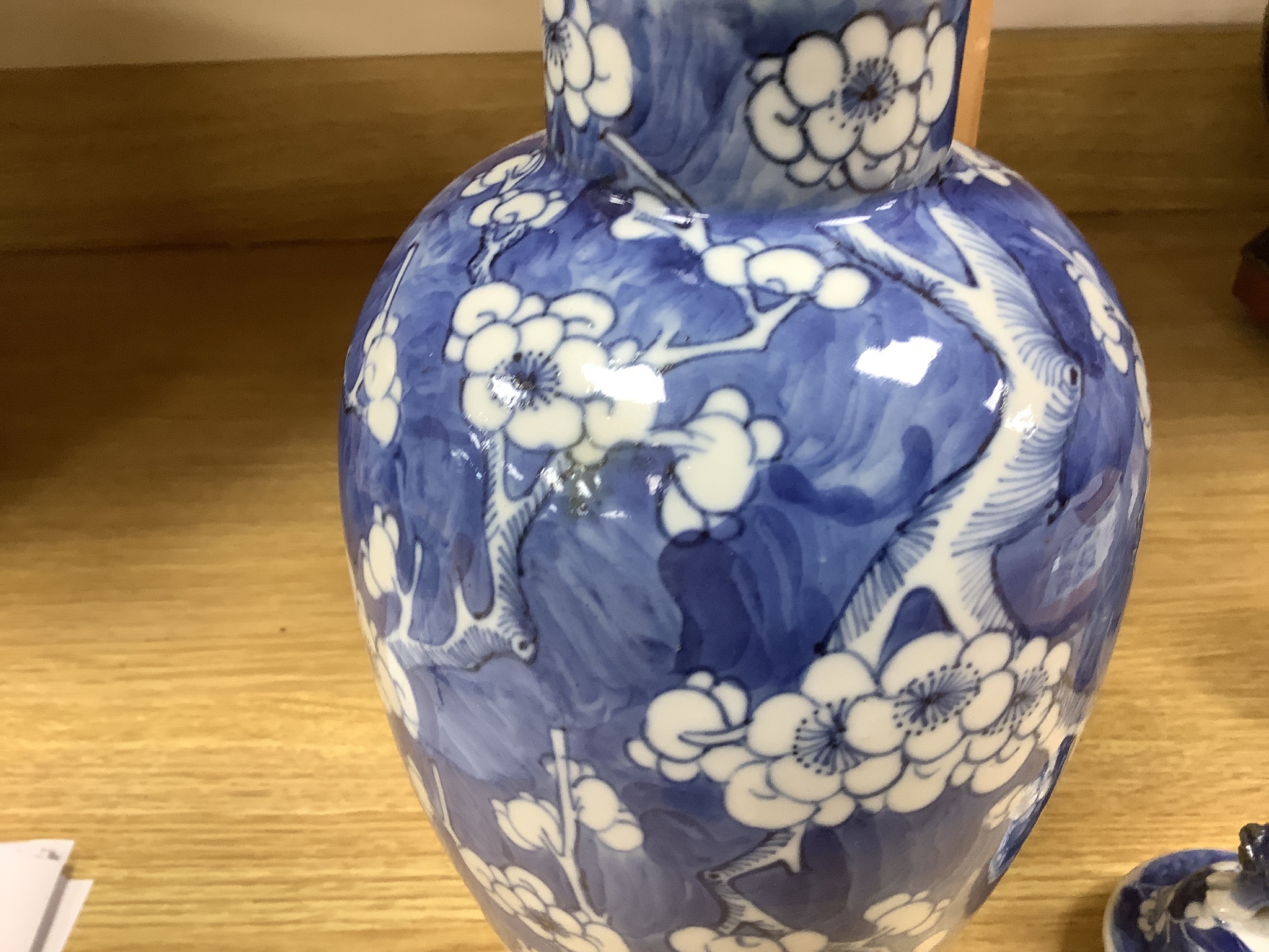 A 19th century Chinese blue and white 'prunus' vase and cover, height 33cm